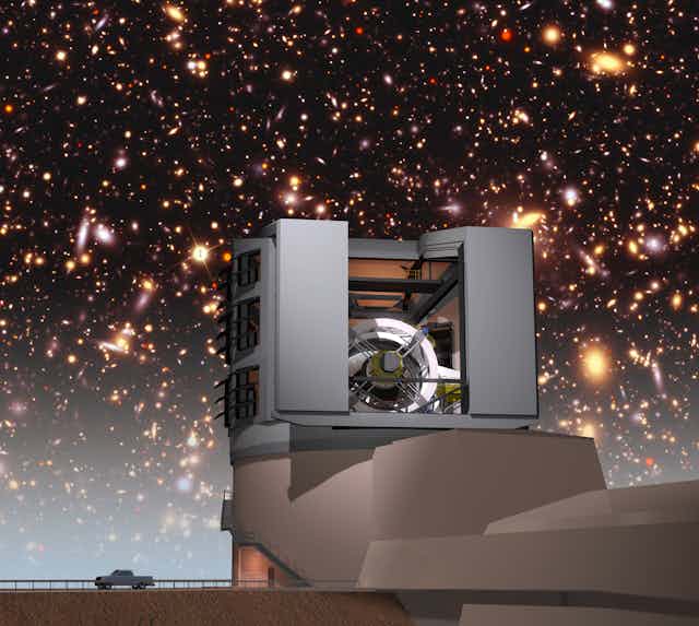 An artist's concept of the Vera Rubin observatory with galaxies in the background.