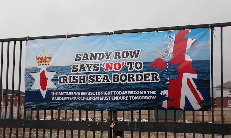 A banner reading Sandy Row says No to Irish Sea Border: The Battles we refuse to fight today become the hardships our children endure tomorrow