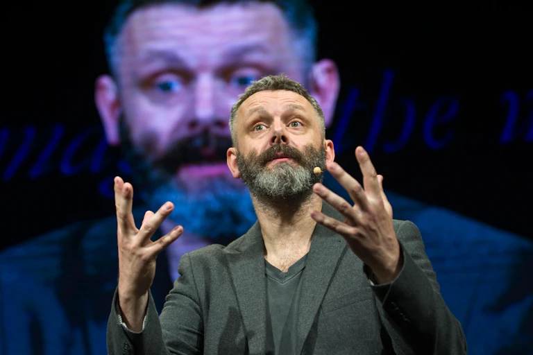 Michael Sheen giving a speech