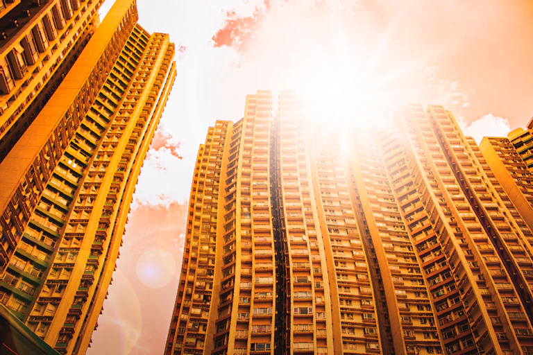 Tower blocks appearing wavy in the heat and direct sunlight.