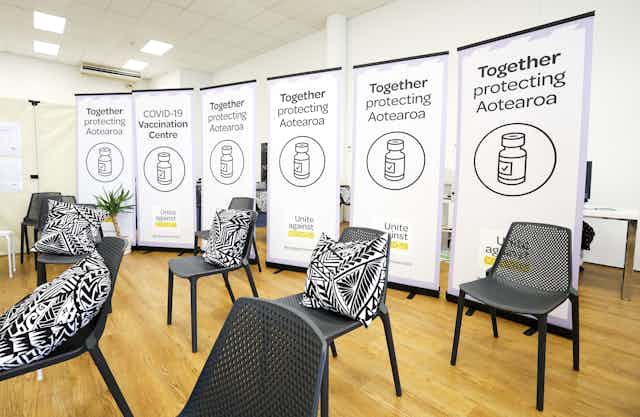 A vaccination room, with chairs and posters