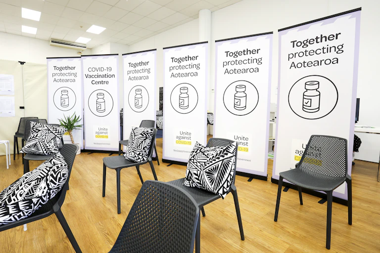 A vaccination room, with chairs and posters
