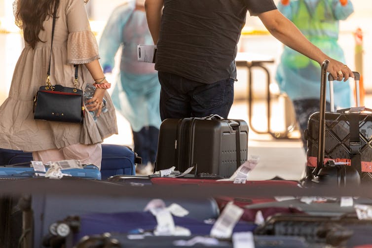 Australians arrive in Darwin on a repatriation flight from India.