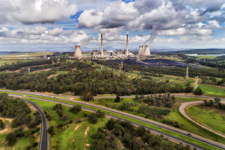 Power station across fields in the distance