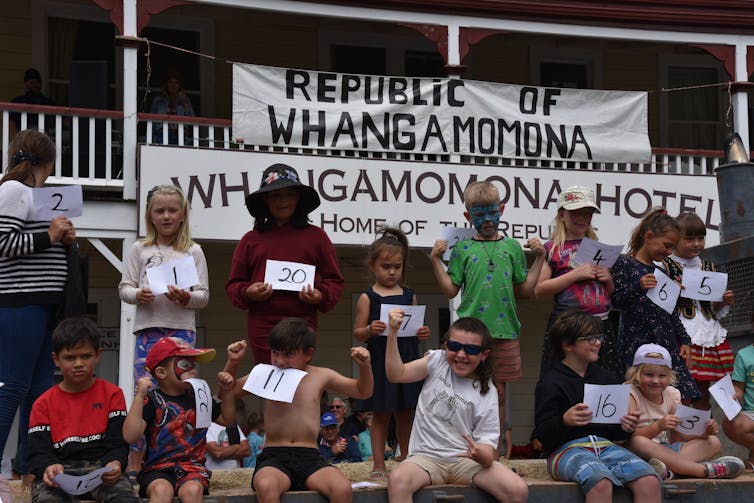 People celebrate out the WhangamÅ&#141;mona Hotel.