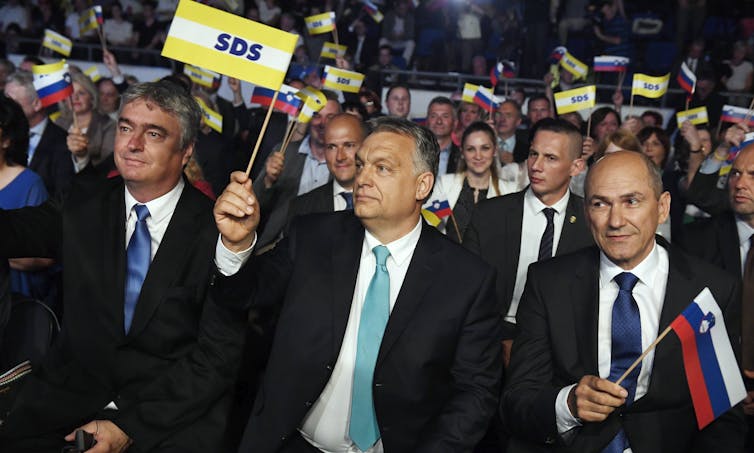 From left: European Parliament member of SDS Milan Zver, Viktor Orbán and Janez Janša pictured at a campaign event.