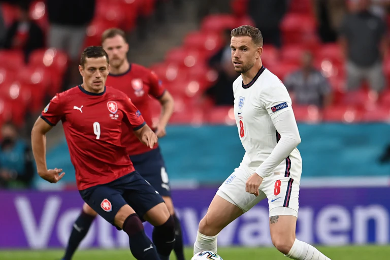 England footballer Jordan Henderson about to be tackled by Tomas Holes of the Czech Republic