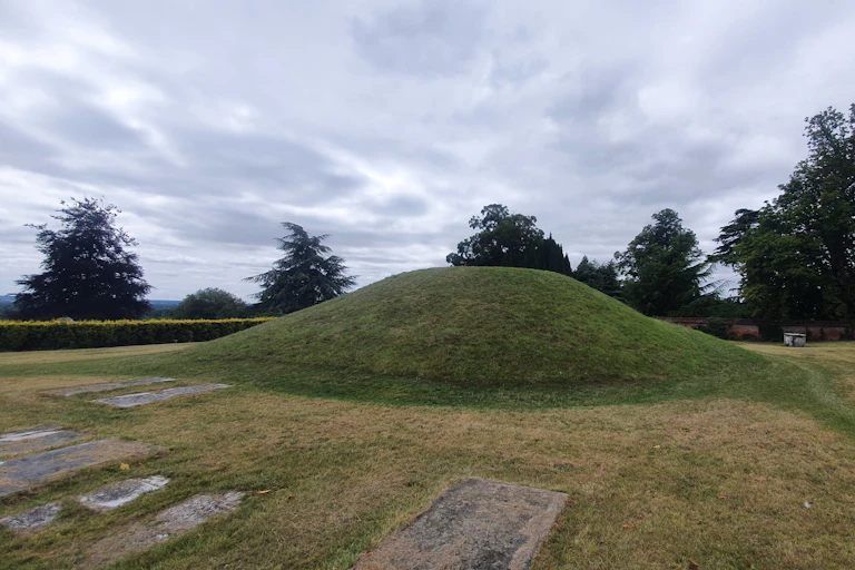 A burial mound surrounded by graves