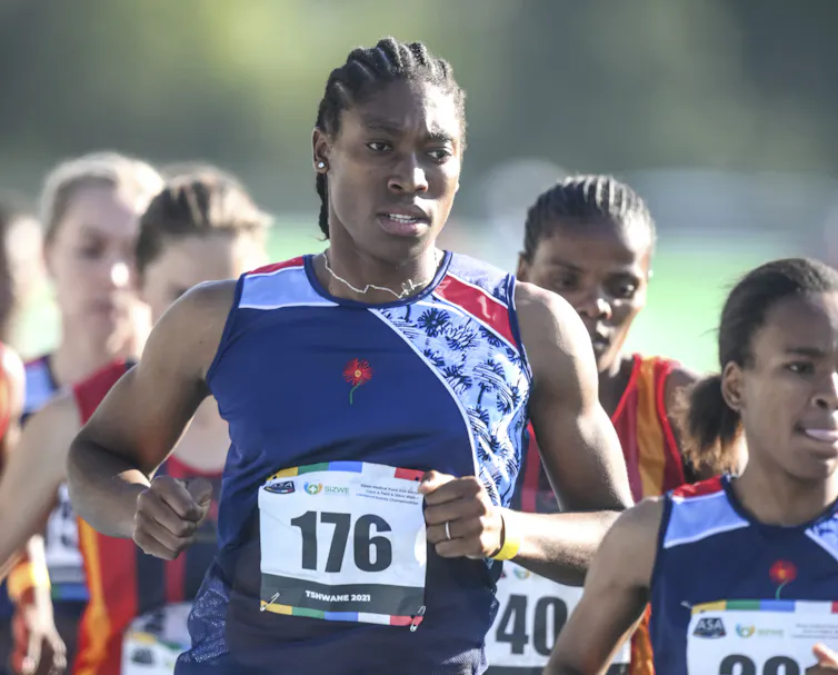 Waist-up shot of Semenya in the middle of a pack of other runners, mid-stride.