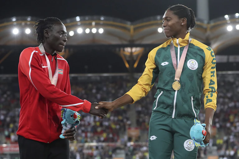Wambui and Semenya shake hands on the podium.