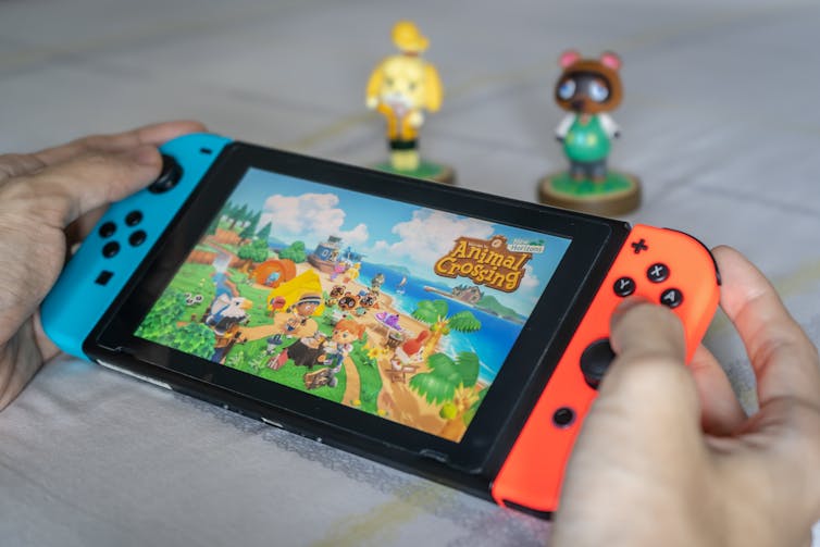 Person playing Animal Crossing on a Nintendo Switch