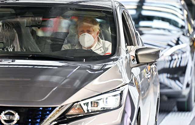 Boris Johnson in a new Nissan on the production line. 