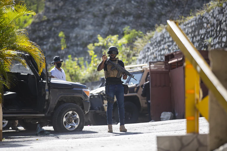 A helmeted guard at the entrance to the Haitian president's residence.
