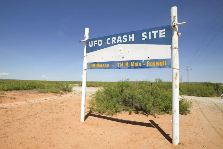 A sign in the desert saying 'UFO crash site.'