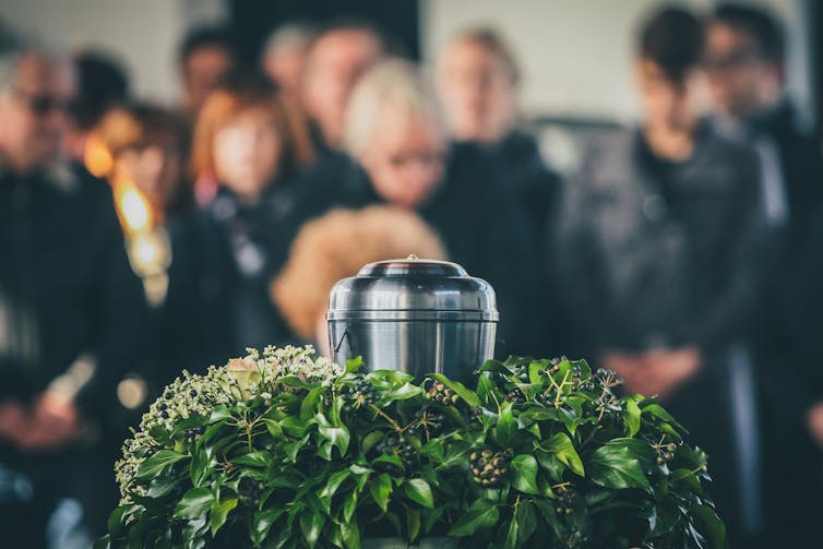 An urn with ashes at a funeral service.