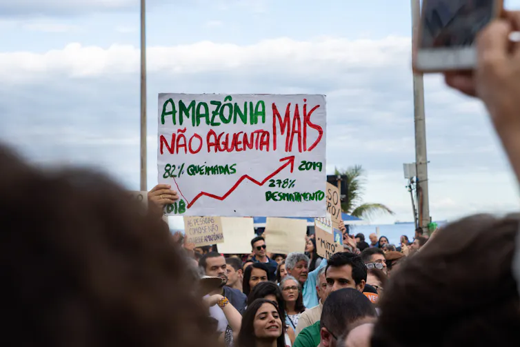 Protester holds up sign