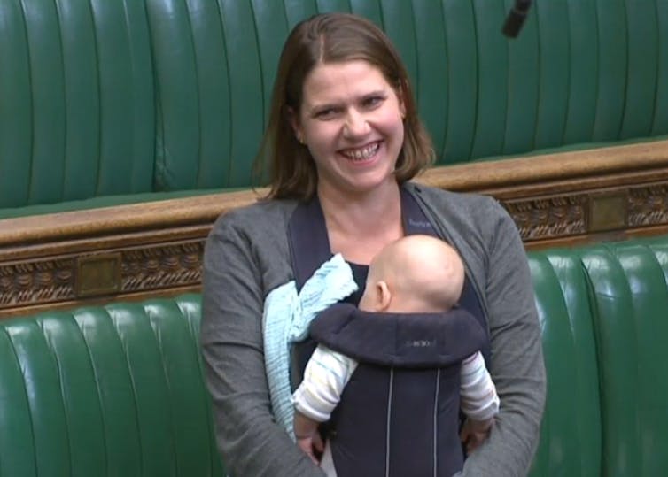 MP Jo Swinson in the House of Commons with an infant in a chest carrier