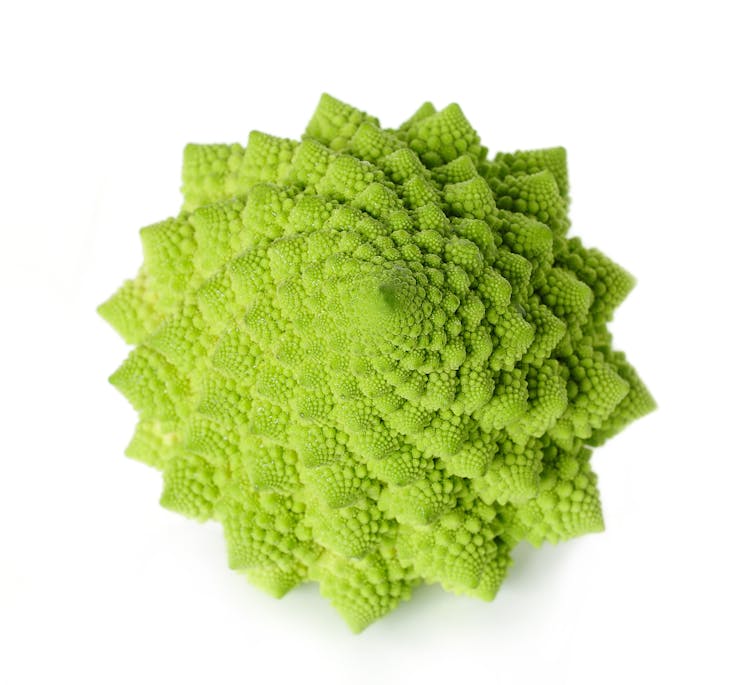 Green cauliflower in many-pointed star shape with spiral patterns.