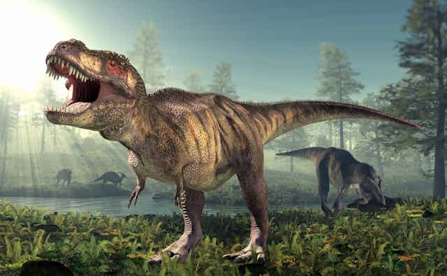 A _Tyrannosaurus rex_ -- a huge dinosaur with a big head and teeth and little front legs --  walks the ground of an ancient forest.