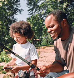 Father and child fishing.