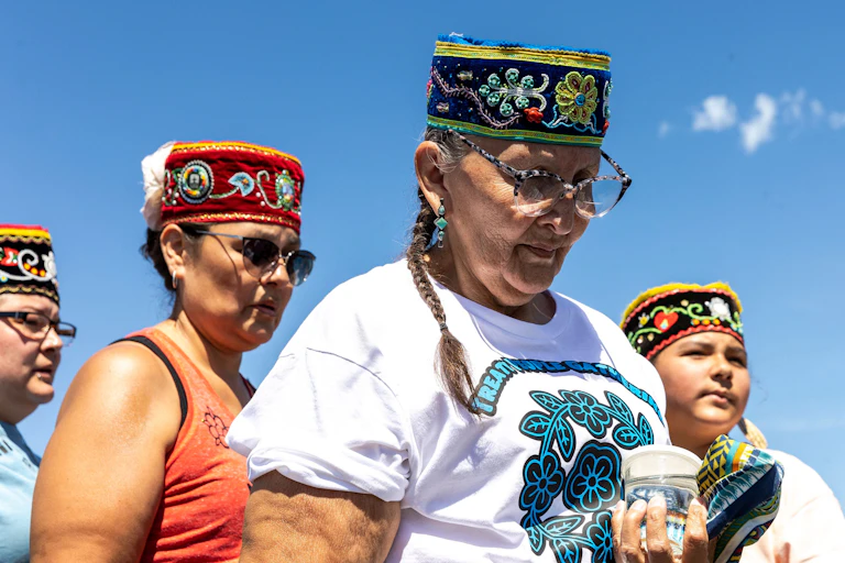 Indigenous women pray for water during an environmental protest