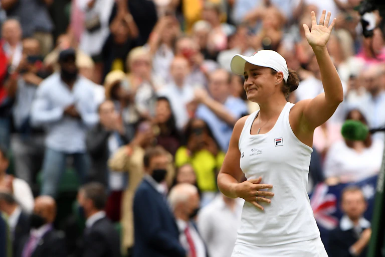Ashleigh Barty waves to the Wimbledon crowd.