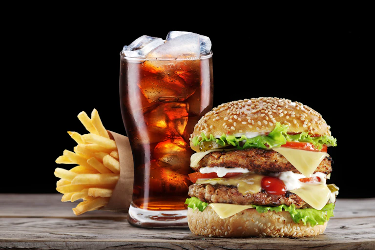 Burger, fries and a drink combo fast food meal