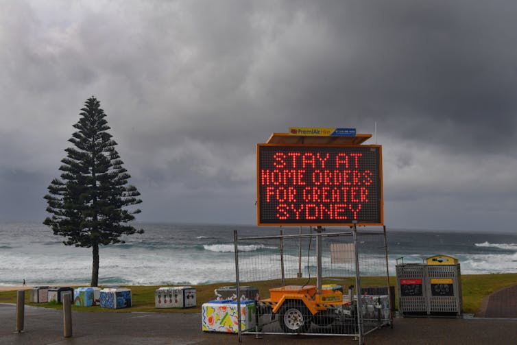 Sign at Bondi Beach 'Stay at home orders for Greater Sydney'.