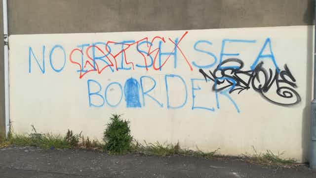 Graffiti protesting the possibility of a border in the Irish Sea on a wall in Belfast.