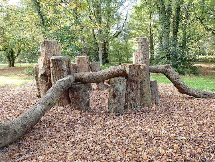 A natural playground built of logs.