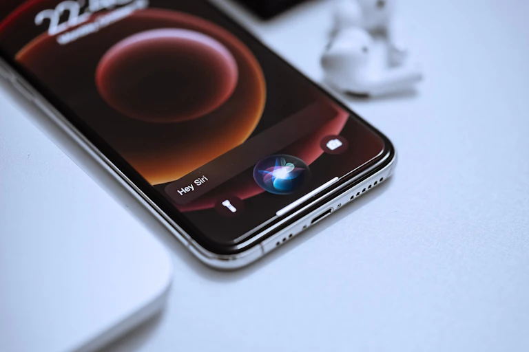 an apple iphone on a white counter