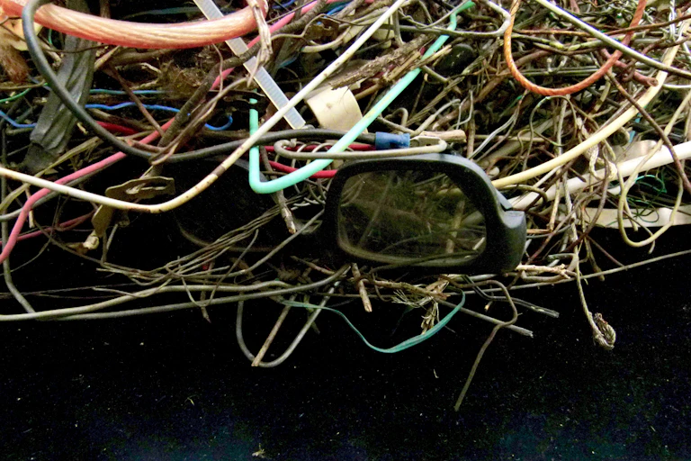 A tangle of 3D glasses, wires and cables