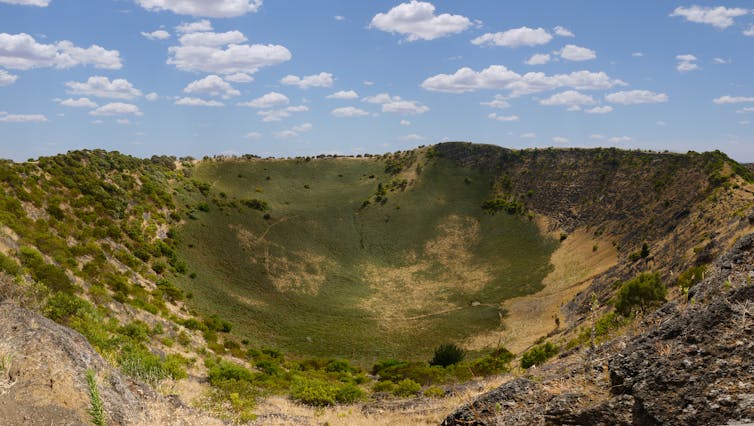 Green, volcanic crater