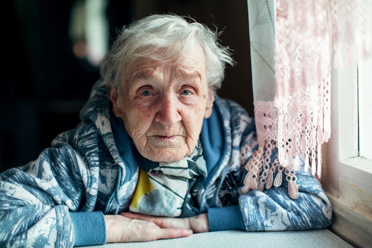 An elderly woman at home.