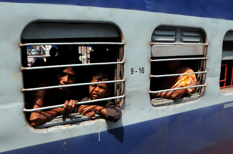 people look out train window