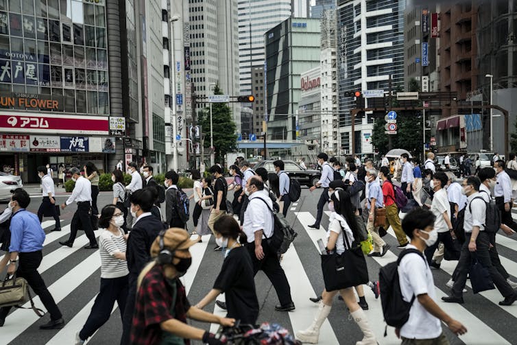 Morning pedestrian traffic in Tokyo on July 13 2021.