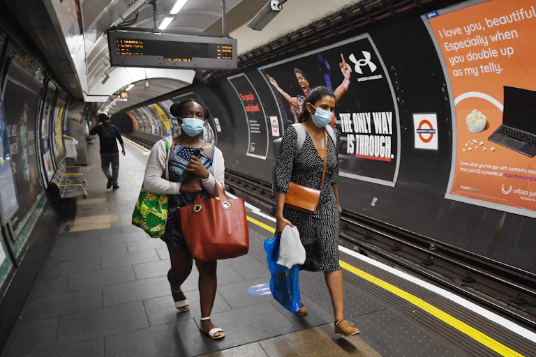 Women wearing face masks on London Underground