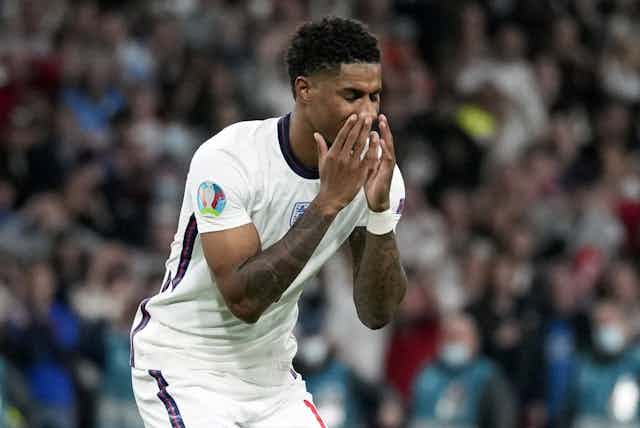 Marcus Rashford reacts after missing a penalty shot in the Euro 2020 final