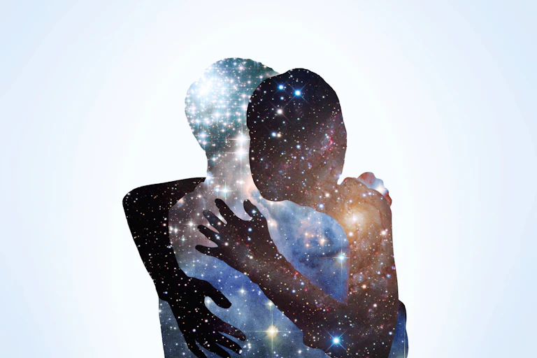 Two people hugging. Each one looks like they are made of stars in the night sky.