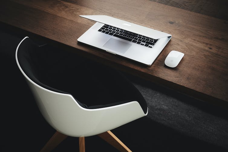 A closed laptop on a desk.