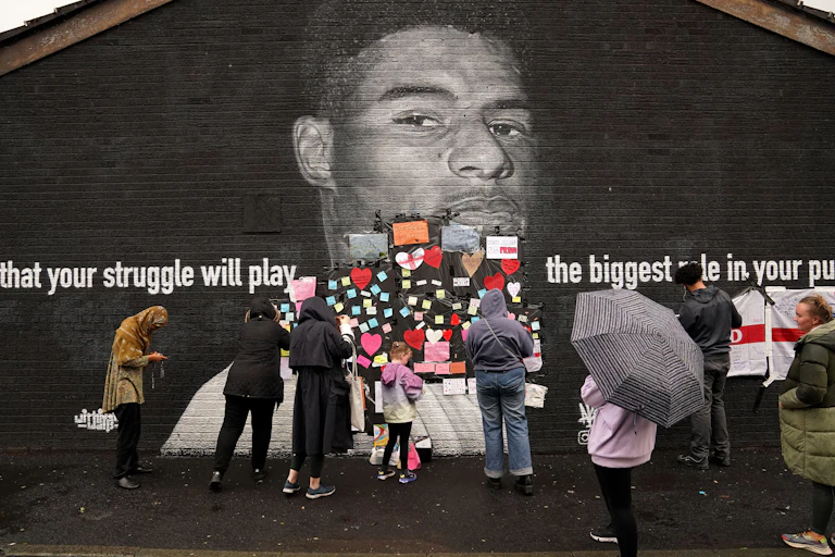 Marcus Rashford mural covered with messages of support after being defaced with racist abuse following Euros 2020