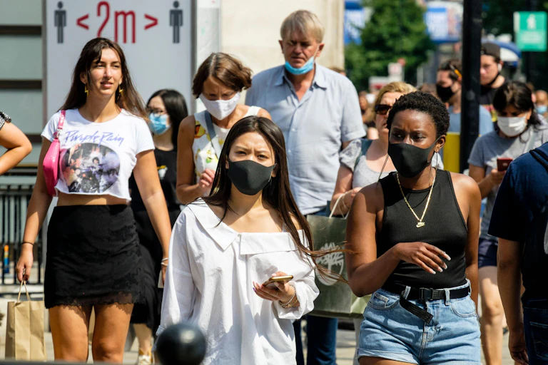 People in masks shopping on Oxford Street