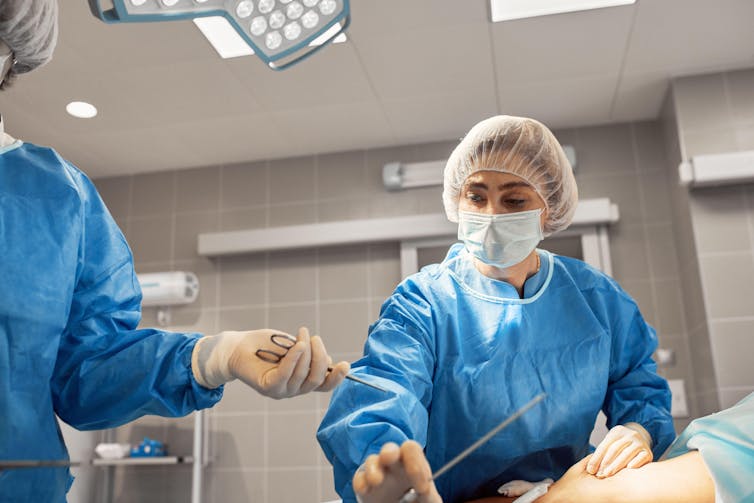 Surgeons in an operating theatre