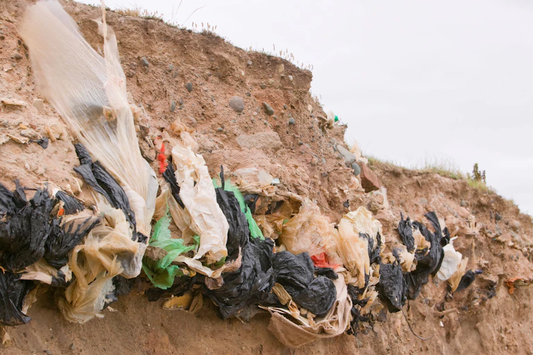 Eroding cliff reveals rubbish