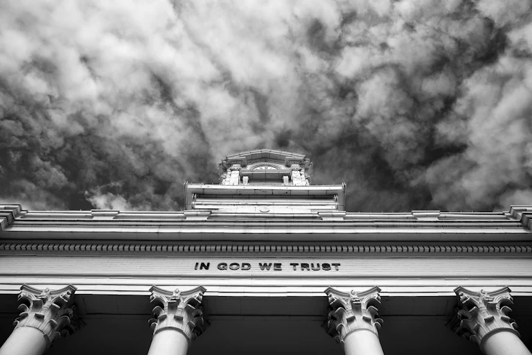 Black and white image of government building/courthouse in small town America.