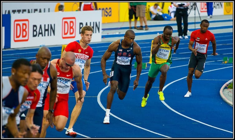 Runners in a staggered spacing coming around a turn.