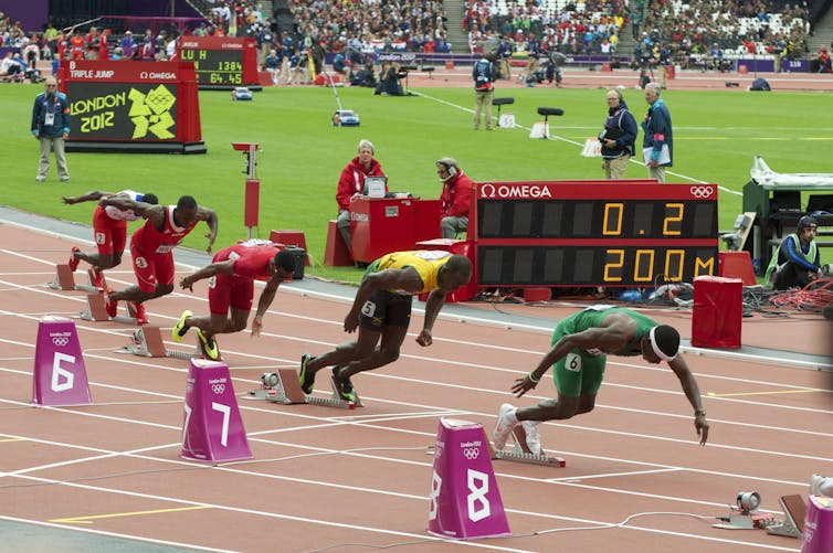 Racers at the starting blocks of a 200m sprint.