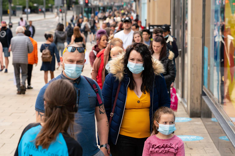 People queuing outside shops in Scotland
