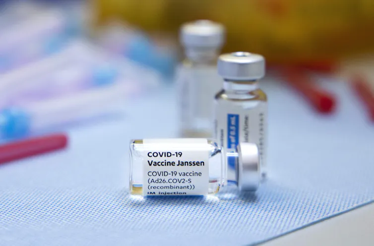 Close-up of three Johnson & Johnson vaccine vials.