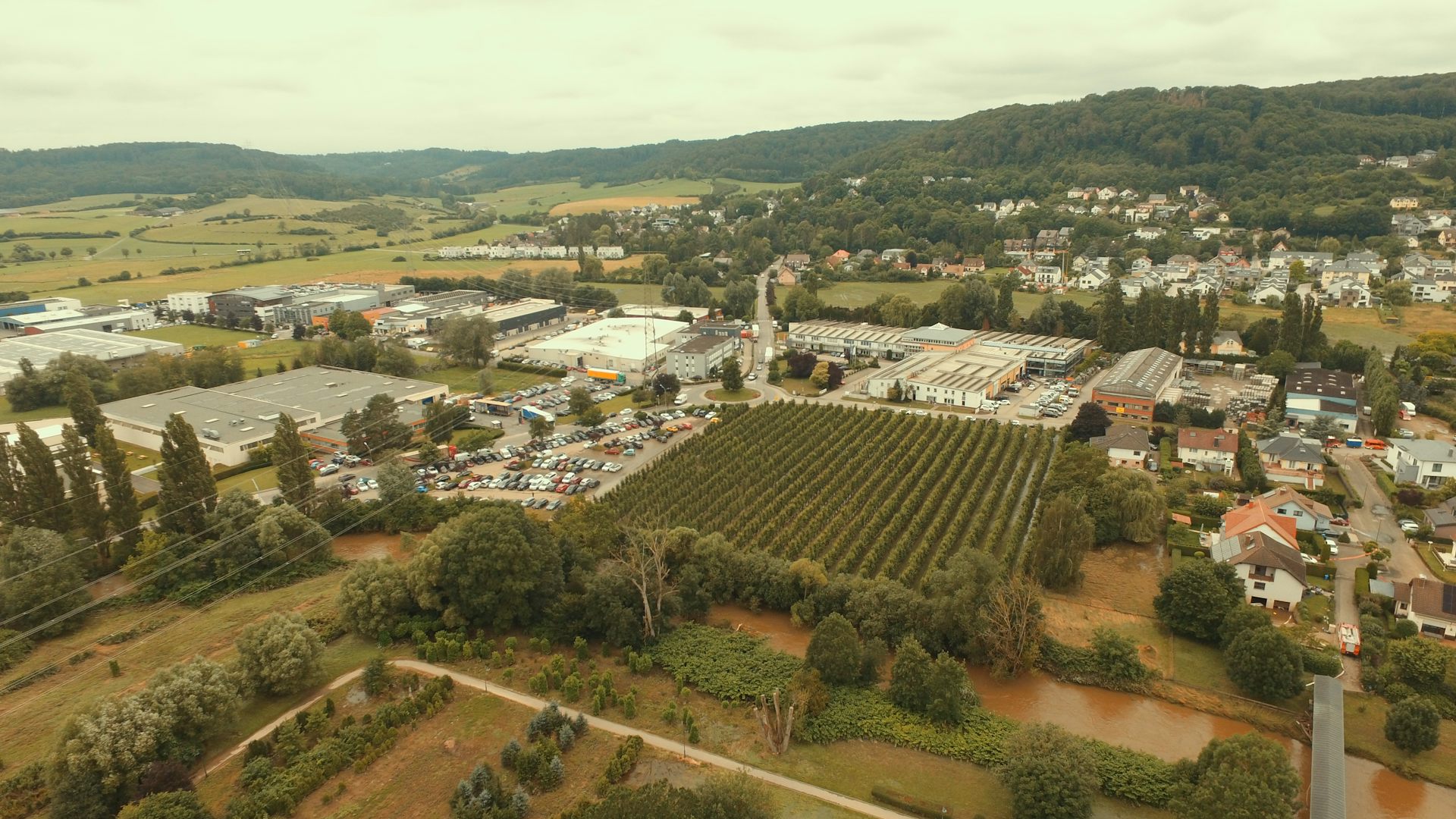 A flooded semi-rural landscape.